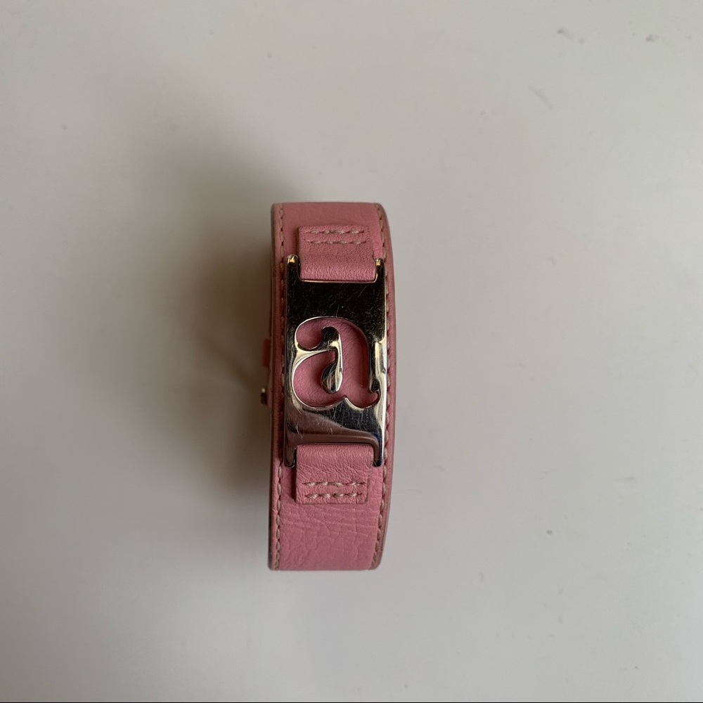 Auth Fossil pink leather “a” bracelet cuff